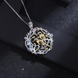 Sky Blue Topaz  with Birds on Openwork Branches Pendant