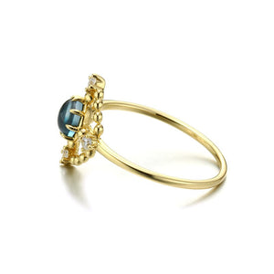 Openwork disc London blue topaz ring